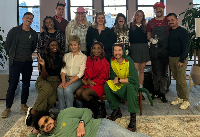 Monday.com employees pose together for a photo