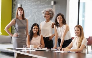 Photo of women bosses together in an office.